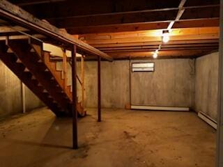 basement featuring a baseboard radiator