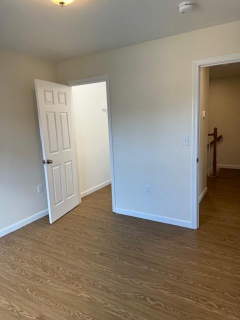 unfurnished room featuring wood-type flooring