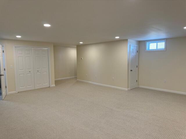 basement with light colored carpet