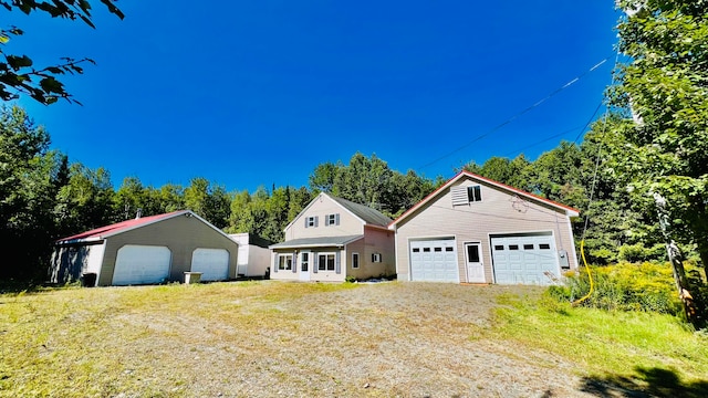 view of front of property with an outbuilding and a garage