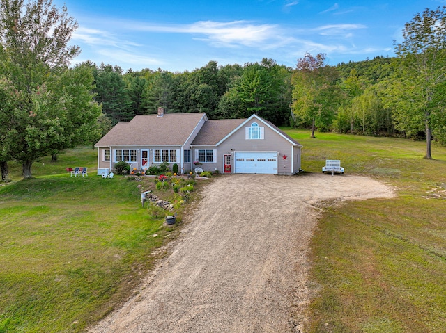 view of front of property featuring a front lawn and a garage