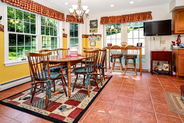 dining area featuring tile patterned floors and a notable chandelier