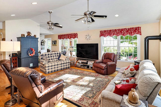 living room with light hardwood / wood-style flooring and lofted ceiling