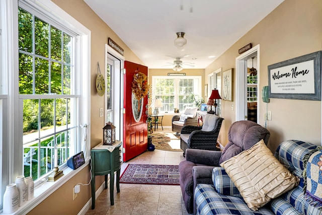 sunroom with a wealth of natural light and ceiling fan