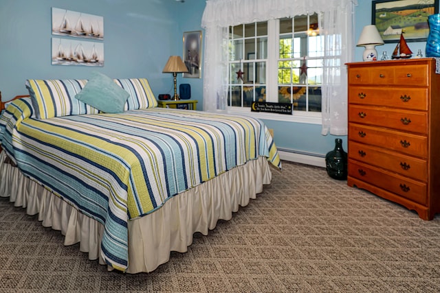 carpeted bedroom featuring a baseboard radiator