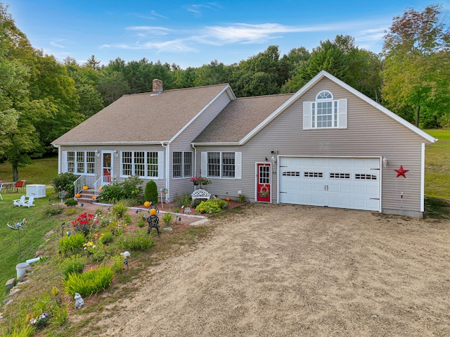 view of front of house with a front lawn and a garage