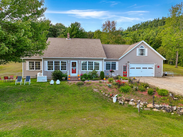 single story home with a front yard and a garage