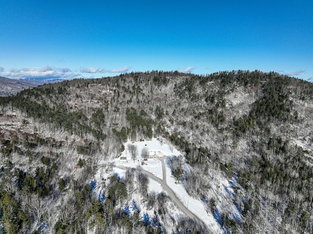 snowy aerial view with a mountain view