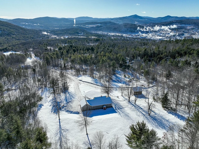 snowy aerial view featuring a mountain view