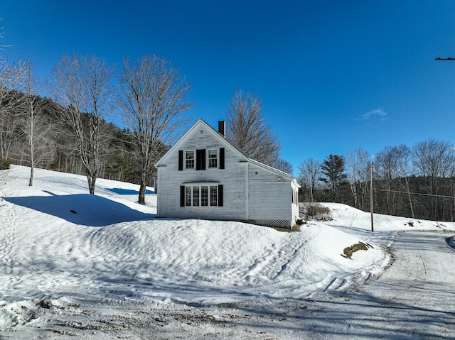 view of snow covered house