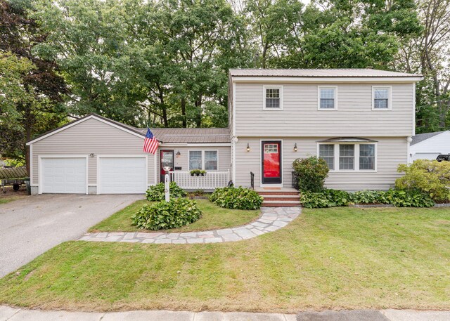 view of front facade featuring a front yard and a garage