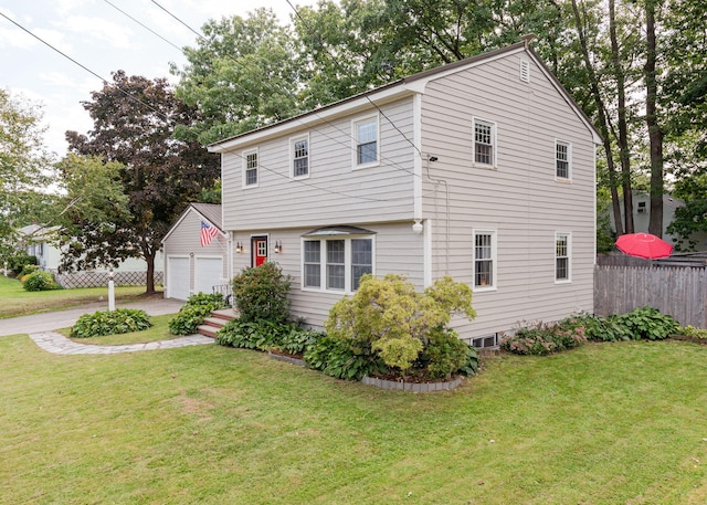 view of front of house featuring an outdoor structure, a front yard, and a garage