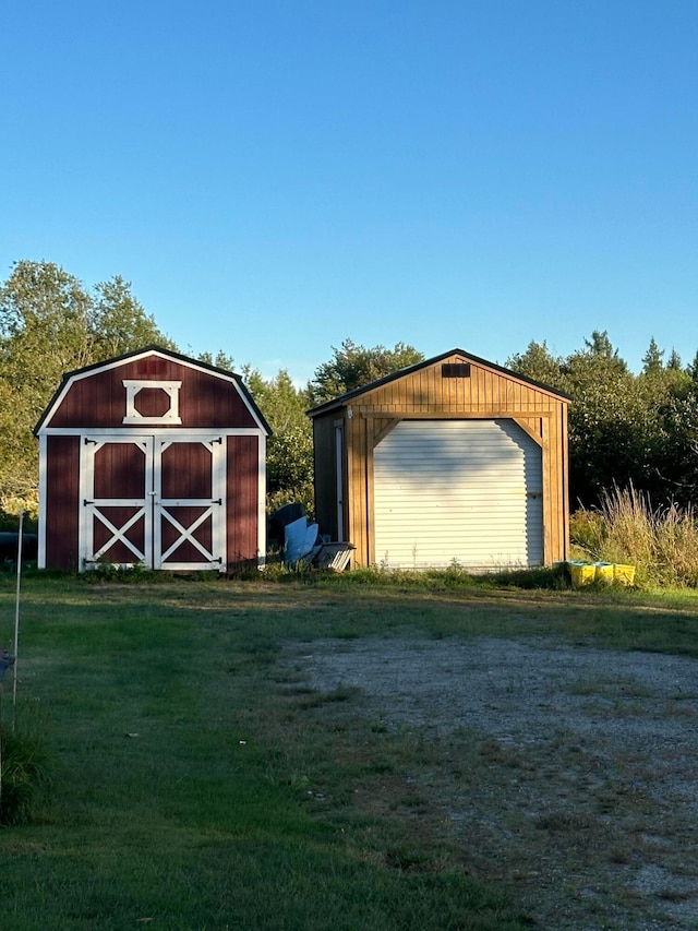 view of outdoor structure featuring a lawn