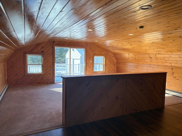 bonus room featuring hardwood / wood-style floors, wood walls, wooden ceiling, and vaulted ceiling