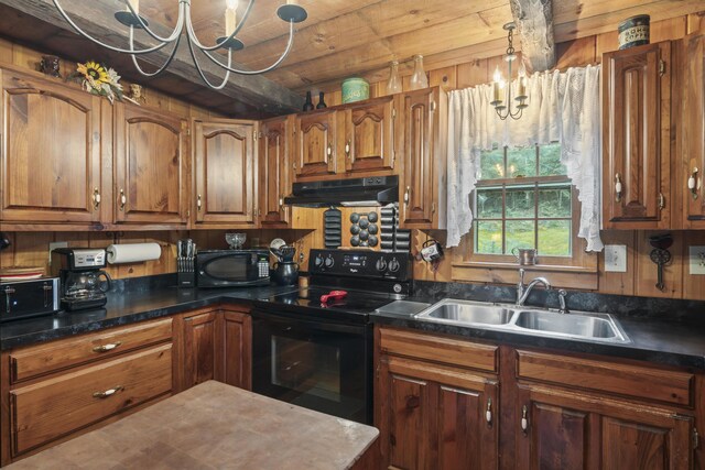 kitchen with pendant lighting, range hood, black appliances, sink, and an inviting chandelier