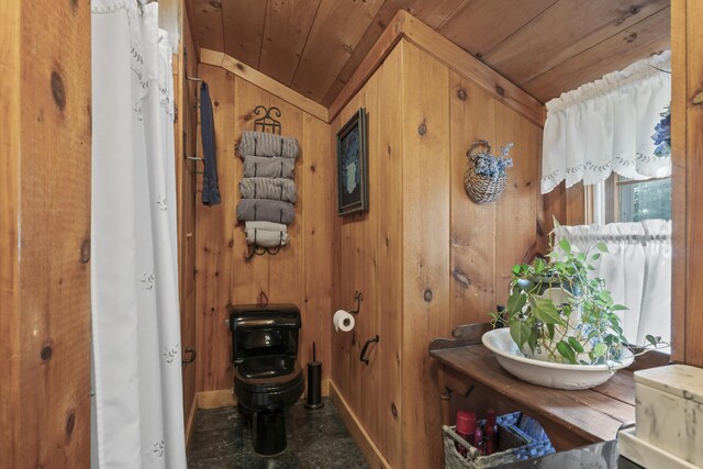 bathroom featuring wood ceiling, toilet, wood walls, and lofted ceiling