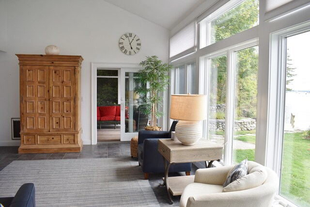 sunroom featuring vaulted ceiling