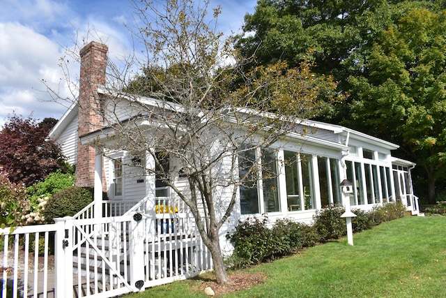 greek revival inspired property with a front yard