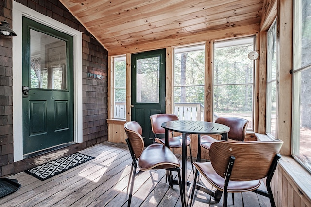 sunroom with lofted ceiling and wood ceiling