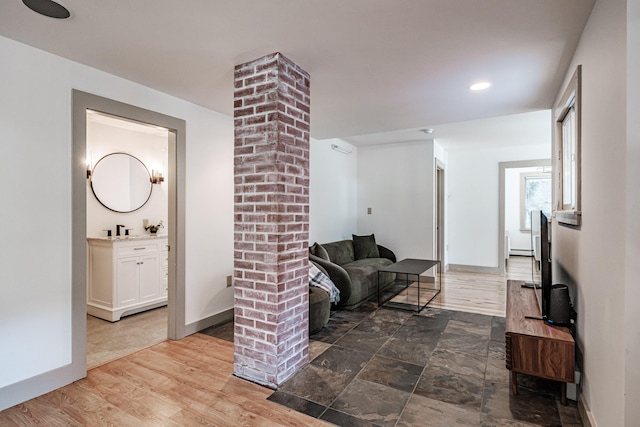 living room with hardwood / wood-style flooring and sink