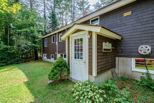 view of property exterior with a lawn