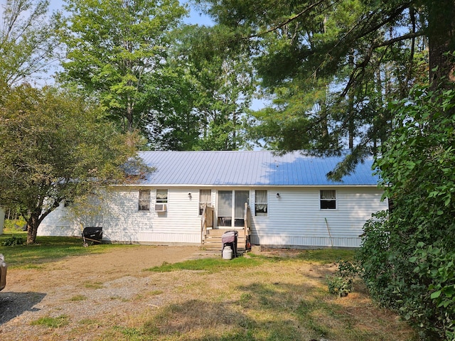 back of house featuring a yard