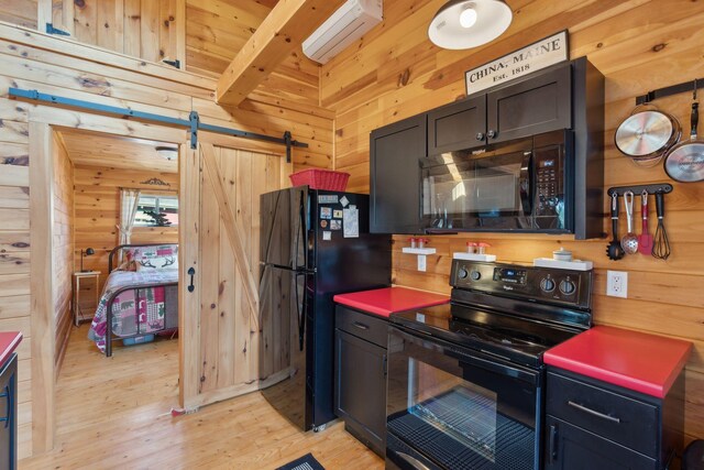 1270 Lakeview Dr Unit 23, China, ME 04358 - kitchen featuring black appliances, an AC wall unit, wood walls, light wood-style flooring, and beamed ceiling