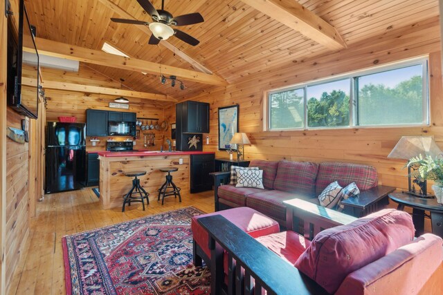 1270 Lakeview Dr Unit 23, China, ME 04358 - living room featuring wooden walls, light wood-style flooring, wooden ceiling, and ceiling fan