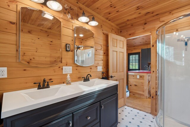 1270 Lakeview Dr Unit 23, China, ME 04358 - bathroom with a shower stall, tile patterned floors, double vanity, wooden walls, and wood ceiling