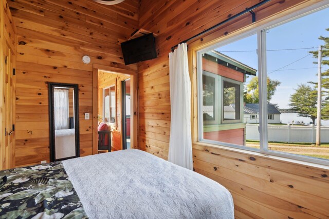 1270 Lakeview Dr Unit 23, China, ME 04358 - bedroom featuring wood walls