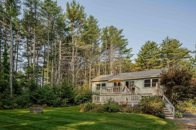 48 Camrock Dr, Rockport, ME 04856 - view of front of home with a front yard, a wooden deck, stairs, and a chimney