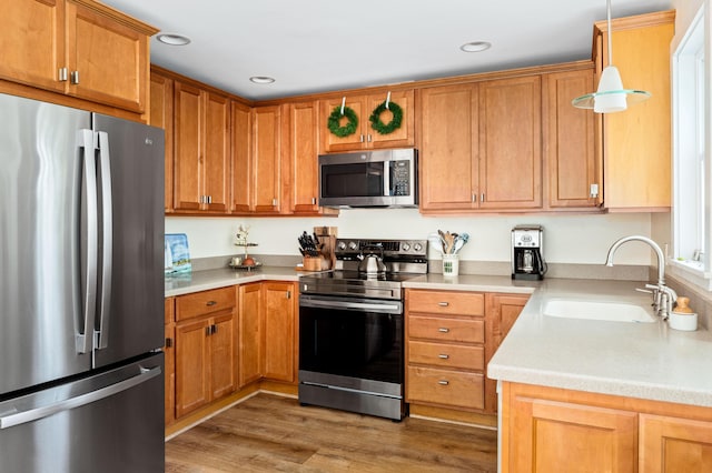 48 Camrock Dr, Rockport, ME 04856 - kitchen featuring stainless steel appliances, a sink, light countertops, wood finished floors, and recessed lighting