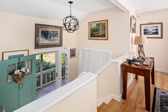 48 Camrock Dr, Rockport, ME 04856 - corridor featuring light wood-style flooring, baseboards, vaulted ceiling, and a chandelier