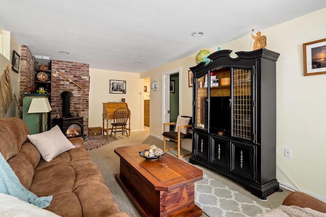 48 Camrock Dr, Rockport, ME 04856 - living room featuring a wood stove, carpet floors, and baseboards
