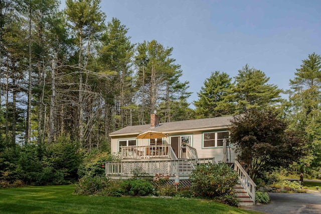 48 Camrock Dr, Rockport, ME 04856 - view of front facade featuring a deck, a front lawn, and a chimney