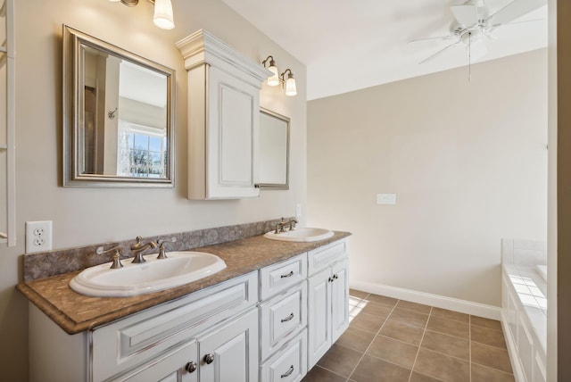 full bath with ceiling fan, tile patterned floors, double vanity, and a sink