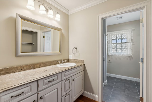 full bath with vanity, baseboards, visible vents, tile patterned flooring, and crown molding