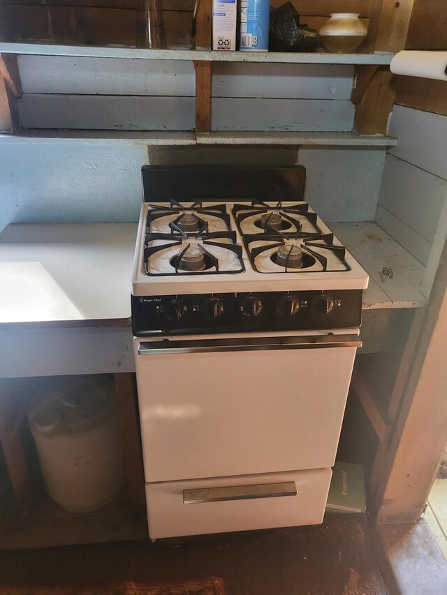 room details featuring white range with gas stovetop