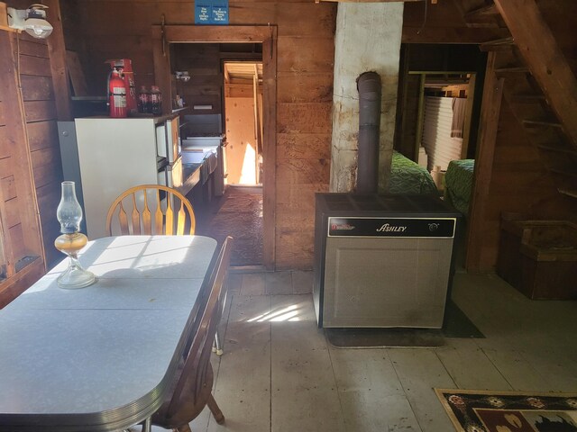 dining area featuring a wood stove