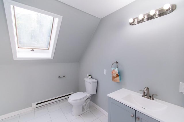 12 Sunset Ln, Otis, ME 04605 - bathroom featuring baseboards, toilet, vaulted ceiling with skylight, vanity, and a baseboard radiator