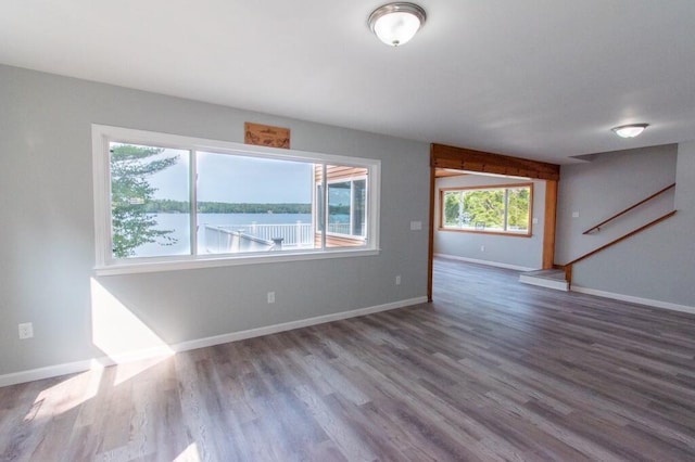 12 Sunset Ln, Otis, ME 04605 - interior space featuring baseboards, wood finished floors, and a water view