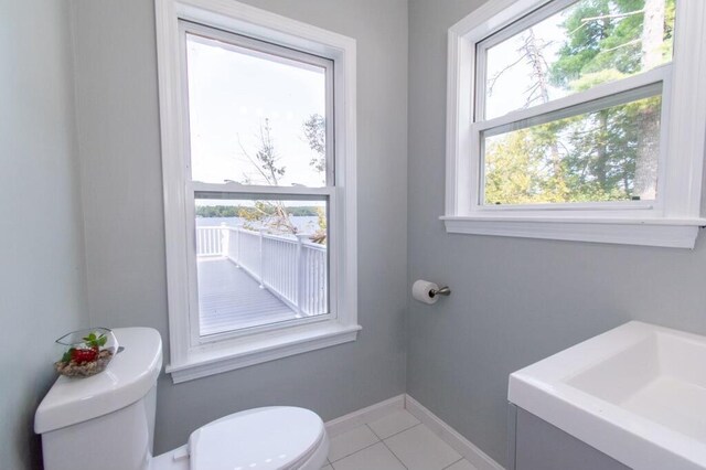 12 Sunset Ln, Otis, ME 04605 - half bathroom featuring tile patterned flooring, toilet, and baseboards