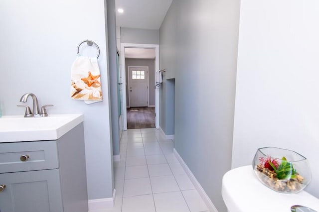 12 Sunset Ln, Otis, ME 04605 - corridor with light tile patterned floors, baseboards, and a sink