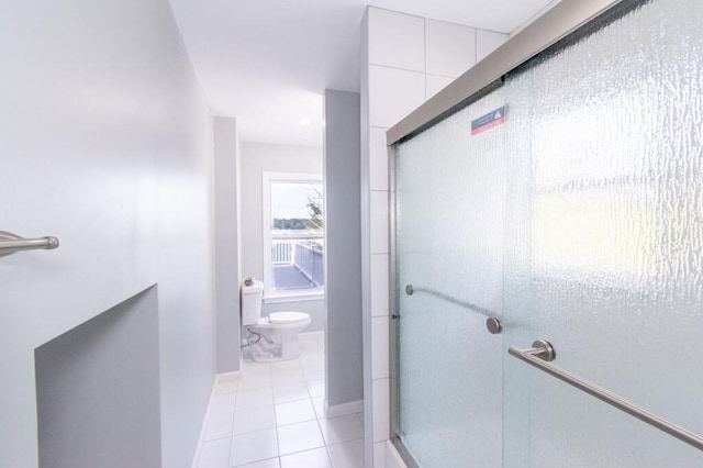 12 Sunset Ln, Otis, ME 04605 - full bathroom with tile patterned floors, toilet, baseboards, and a stall shower