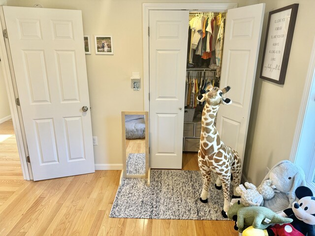 bedroom featuring a closet and light hardwood / wood-style floors