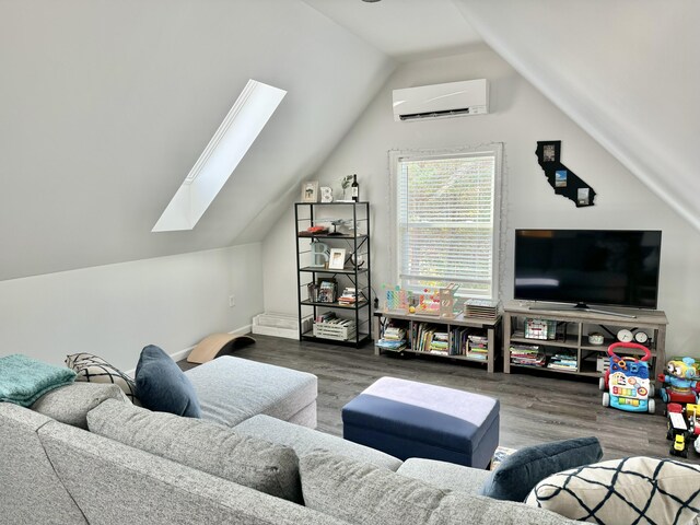 living room featuring vaulted ceiling with skylight, wood-type flooring, and an AC wall unit