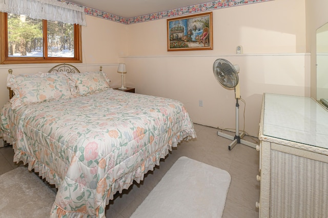 bedroom featuring light tile patterned flooring