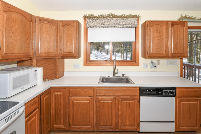 kitchen featuring sink and white appliances