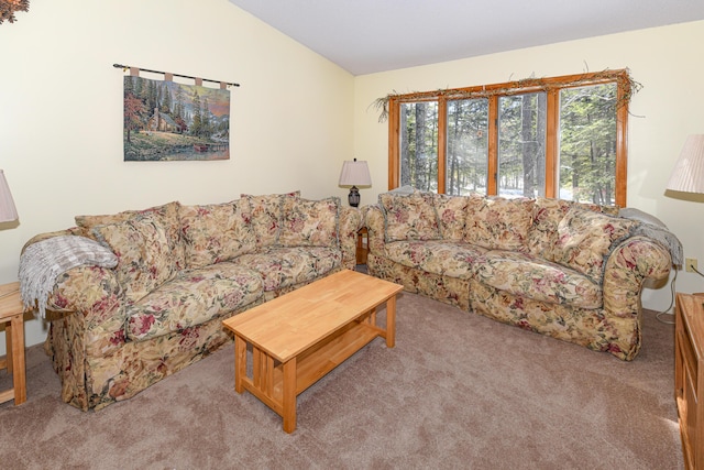 living room with light colored carpet and vaulted ceiling