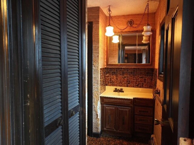 bathroom with vanity and backsplash